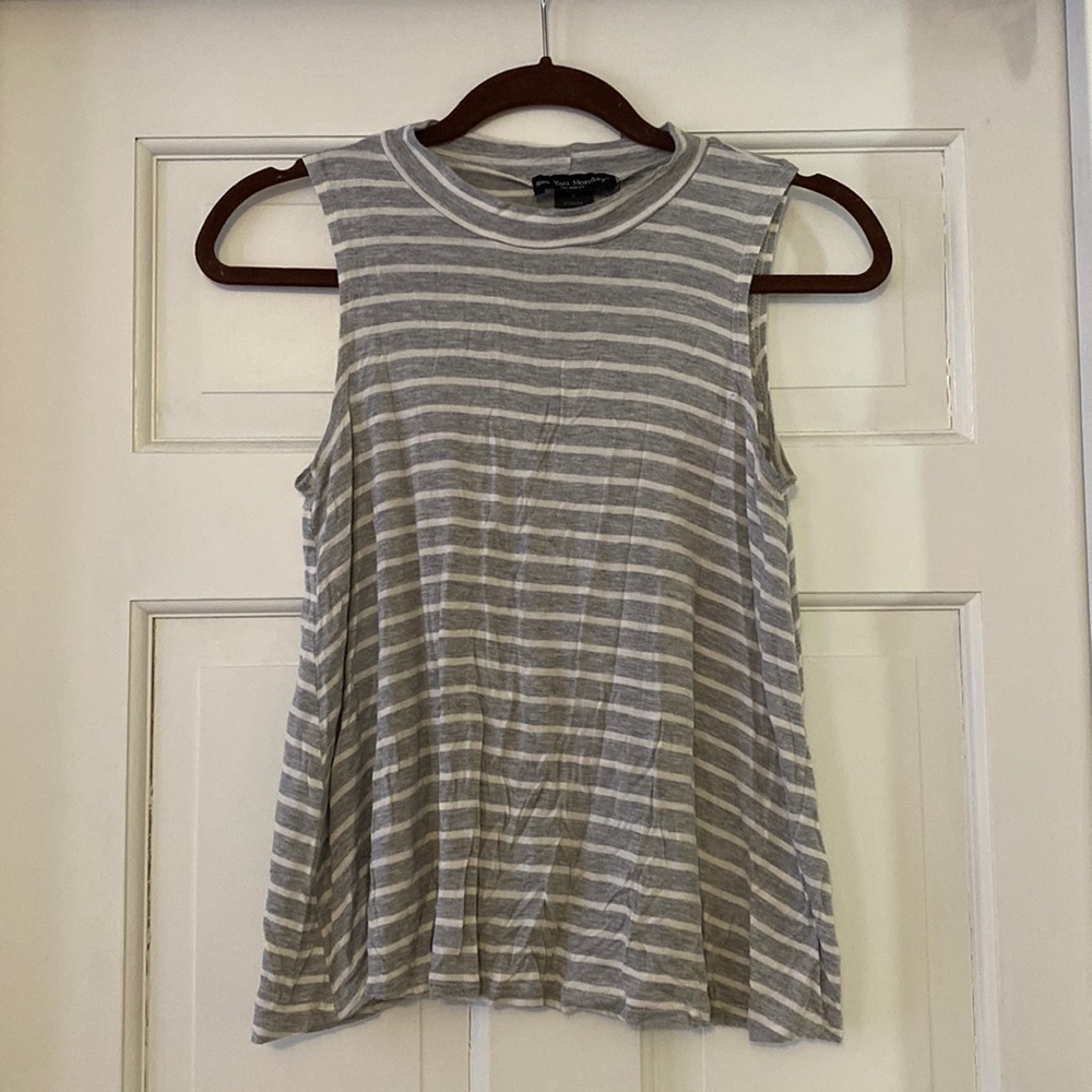 White and grey striped, loose fitting tank with high neck.